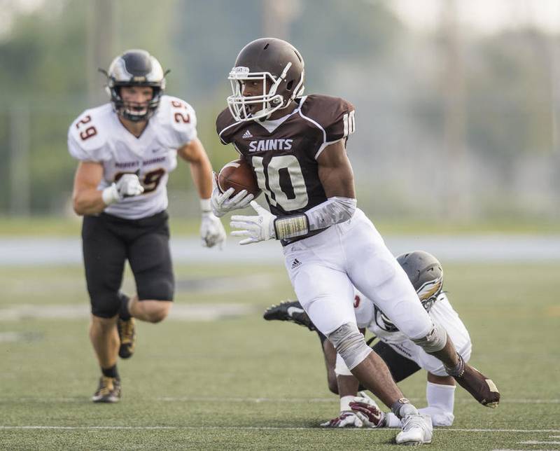 University of St. Francis receiver Lexus Jackson eludes the Robert Morris defense during a play Saturday at Joliet Memorial Stadium. Jackson had nine receptions for 117 yards and a touchdown.