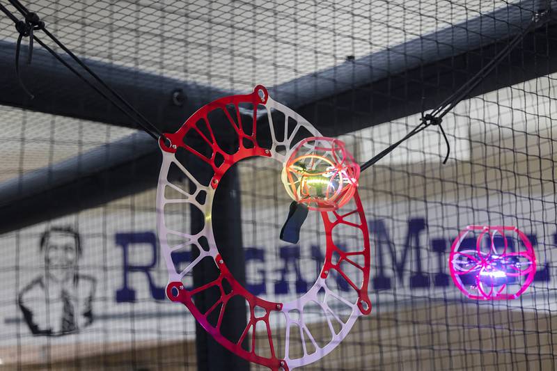 A drone passes through the goal Wednesday, Jan. 25, 2024 at Reagan Middle School. In drone soccer only one player, the striker, is allowed to score. Their teammates are there for support and defense.