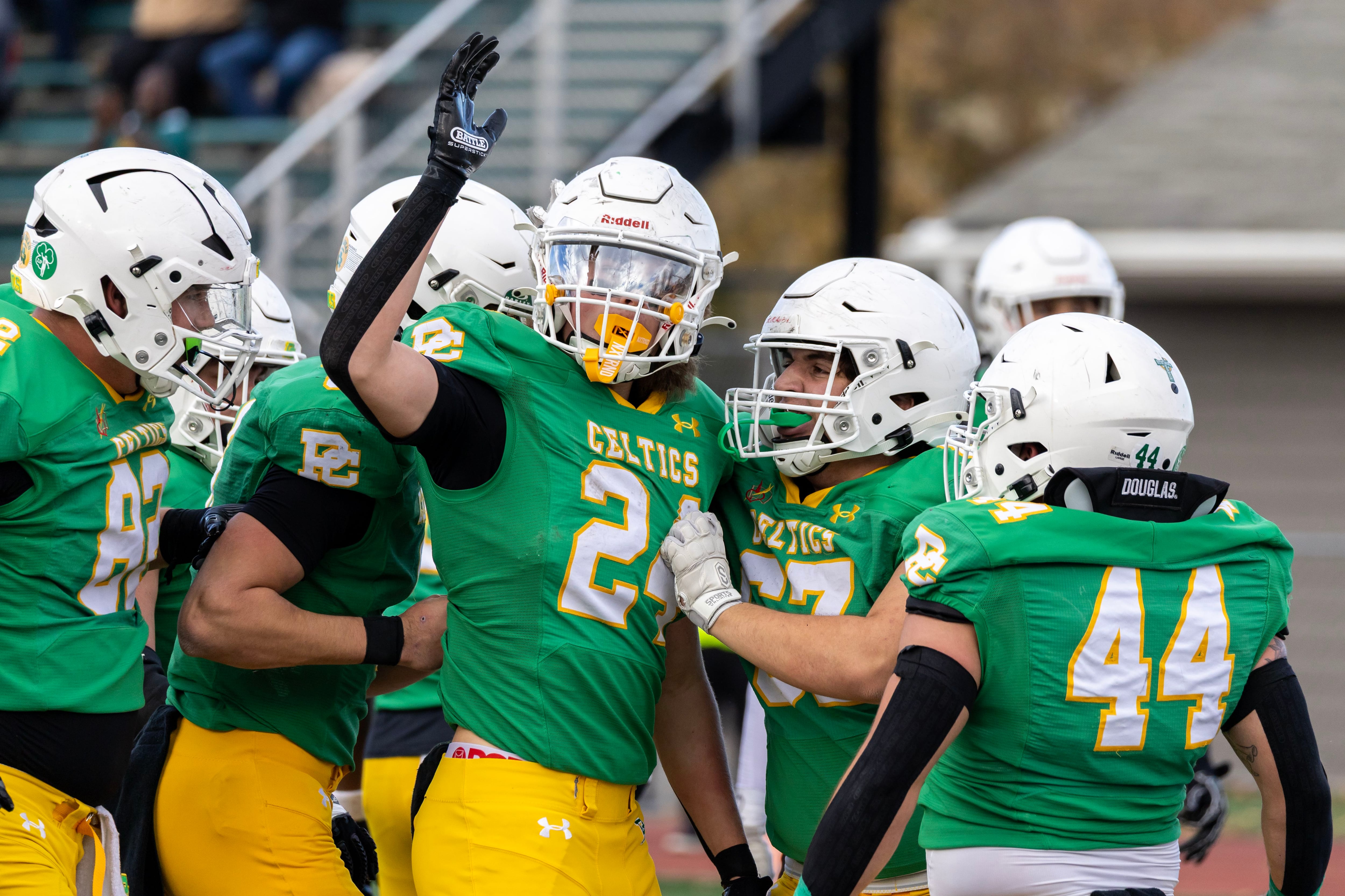 Providence's Broden Mackert celebrates with teammates after scoring a touchdown during a 5A varsity football playoff game against Washington at Providence on Nov. 15, 2025.