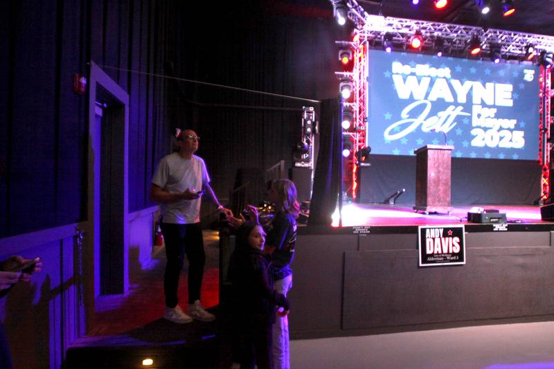 McHenry mayoral candidate and incumbent Wayne Jett hosted an election night party at The Vixen in McHenry on Tuesday, April 1, 2025. Jett waits in the wings for his stage celebration to begin.