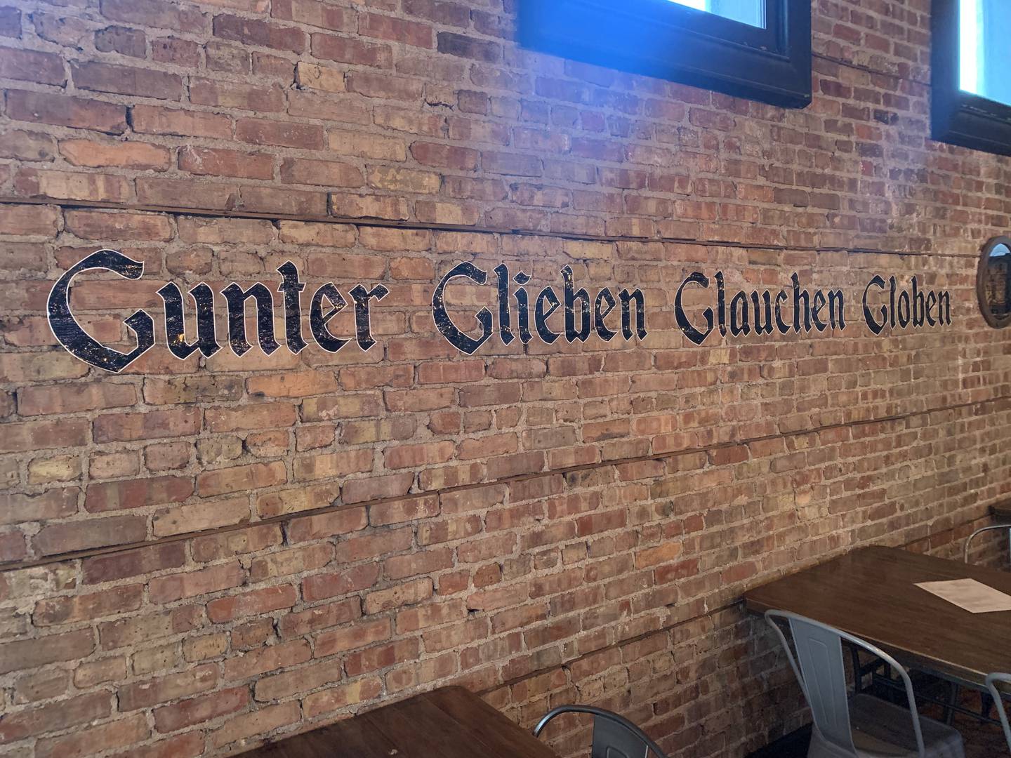 The words “Gunter Gleiben Glauchen Globen” from Def Leppard’s 1980s hit “Rock of Ages” are painted on a brick wall at Richmond Brat Haus.