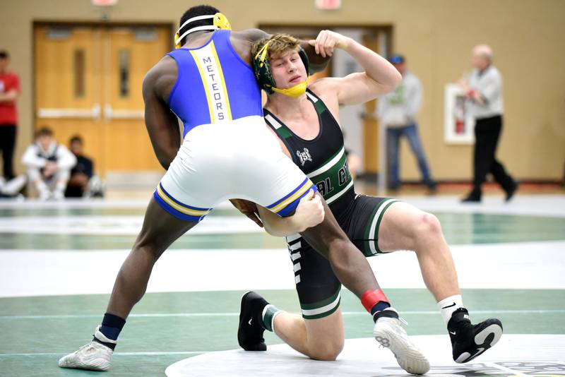 Coal City's Landin Benson looks to grab a hold of De La Salle's Marquis Mays during the 175-pound championship match at the IHSA Class 1A Coal City Sectional Saturday, Feb. 15, 2025.