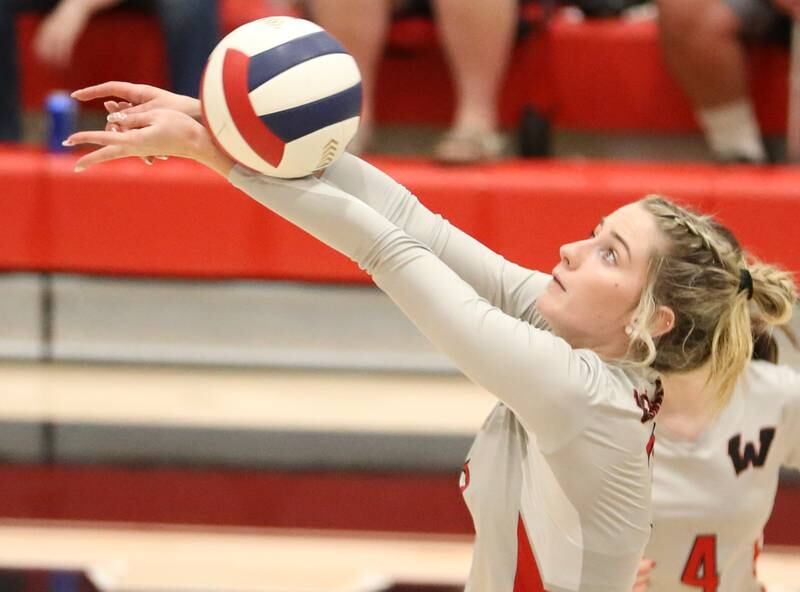 Woodland's Malayna Pitte bumps the ball to go over the net against Earlville on Wednesday, Sept. 25, 2024 at Woodland High School.
