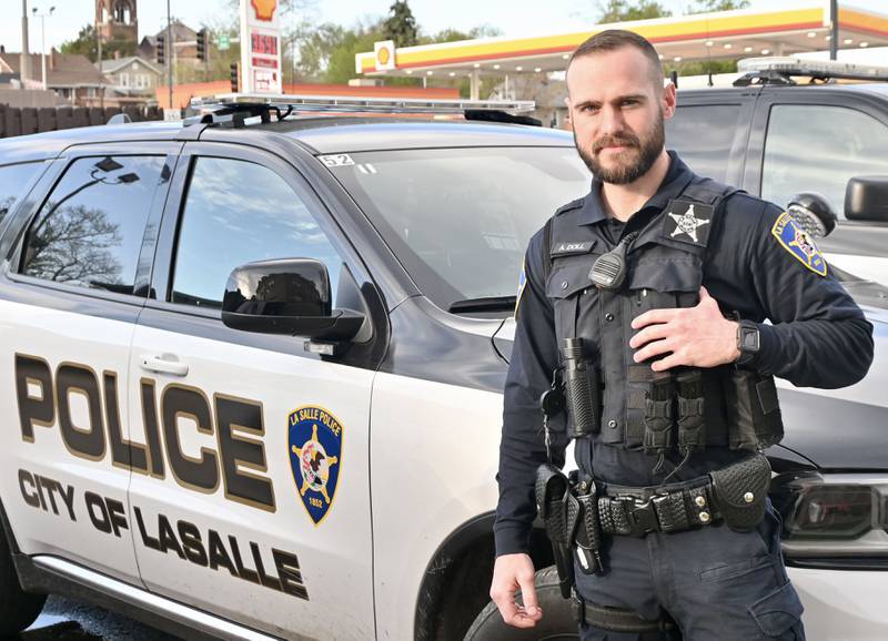 La Salle Police officer Alex Doll poses for a photo at the La Salle Police Station.