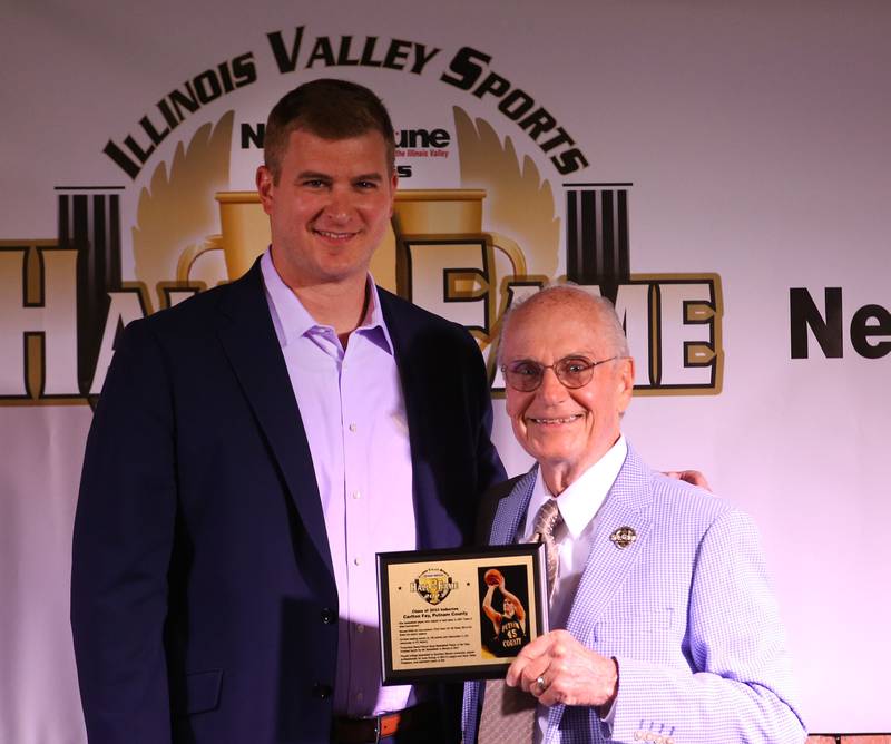 Carlton Fay poses with  Lanny Slevin Emcee during the Shaw Media Illinois Valley Sports Hall of Fame on Thursday, June 8, 2023 at the Auditorium Ballroom in La Salle. Fay was a star basketball player at Putnam County High School and led the team to the Class 1A State tournament in 2007.