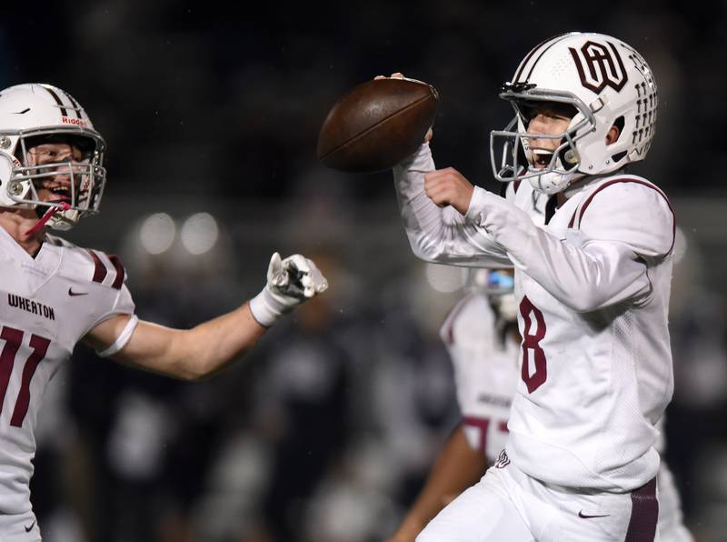 Joe Lewnard/jlewnard@dailyherald.com
Wheaton Academy quarterback Brett Kasper, right, and teammate Zachary Moravec celebrate their team’s 12-3 victory over St. Viator during Friday’s Class 4A football playoff in Arlington Heights Friday.