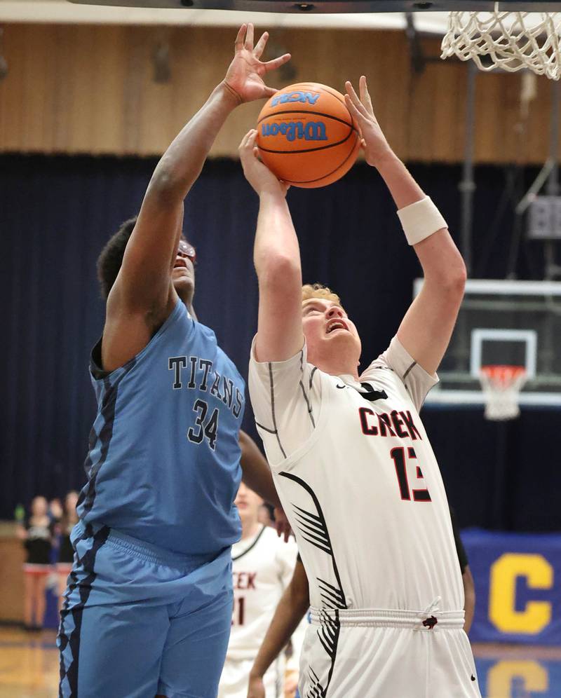 Indian Creek's Isaac Willis shoots in front of IMSA’s Lota Onwuameze Friday, Feb. 6, 2026, during their Little 10 Conference championship game at Somonauk High School.