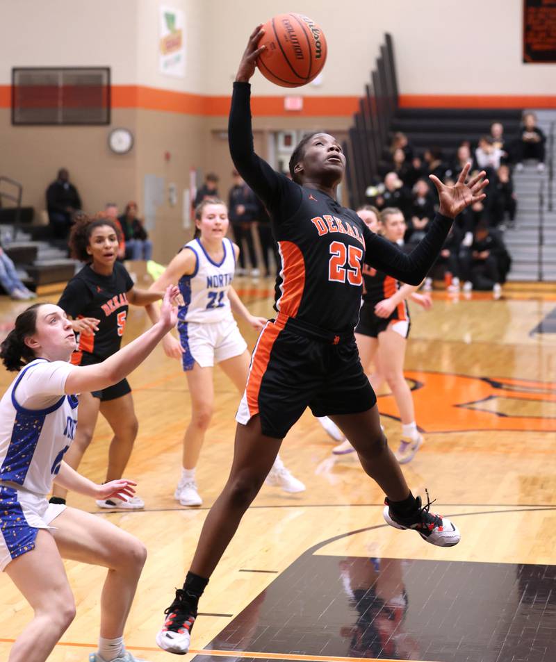 DeKalb’s Kezaria Mitchell pulls down a rebound of a missed Wheaton North shot during their Class 4A regional game Monday, Feb 12, 2024, at DeKalb High School.