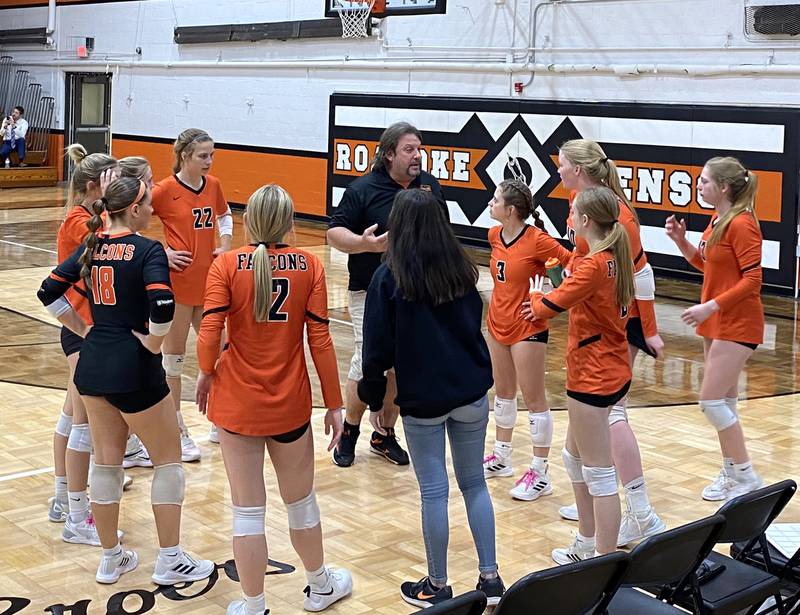 Flanagan-Cornell girls volleyball coach Joe Estes instructs his Falcons during a first-set timeout Thursday, Oct. 27, 2022, in the championship match of the Class 1A Roanoke-Benson Regional.
