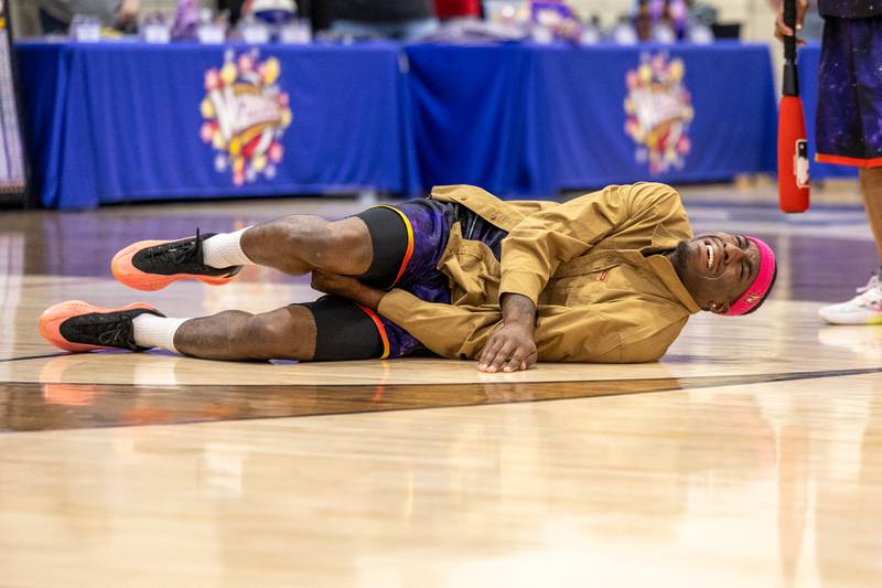 Kamil “Dragon” Brown (77) of the Harlem Wizards lays on floor after being “hit” on Wednesday, April 16, 2025 at Woodland High School in Woodland.