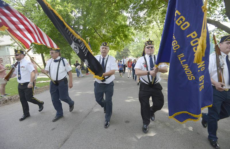 American Legion Post 675 Honor Guard leads down Main Street during Oswego's annual Memorial Day parade on Saturday, May 30, 2022.