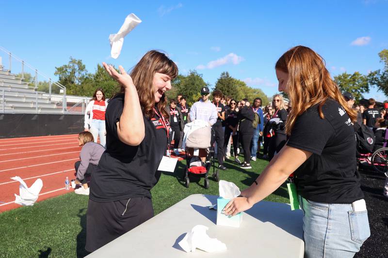 Bradley-Bourbonnais senior Josie Brandon, left, competes in the tissue box game with help from her buddy Hailey Porter during the annual Boilermaker Games, hosted by the Best Buddies club on Wednesday, Oct. 8, 2025, at Bradley-Bourbonnais Community High School.