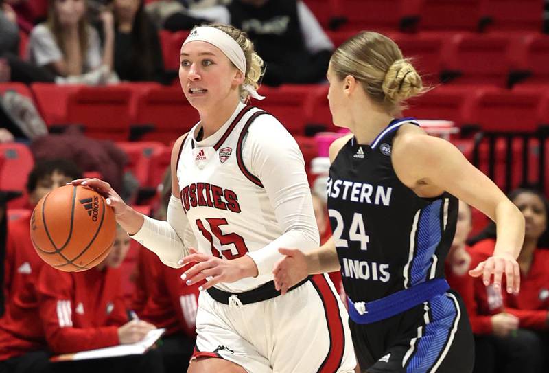 Northern Illinois' Grace Hunter pushes the ball up court against Eastern Illinois' Ellie Buzzelle during their game Monday, Dec. 18, 2023, at the Convocation Center at NIU in DeKalb.