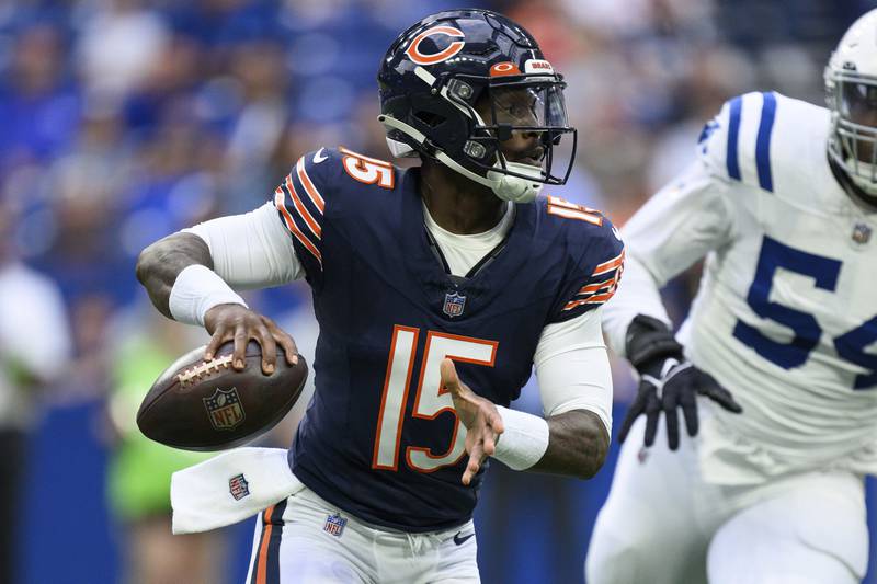 Chicago Bears quarterback P.J. Walker scrambles out of the pocket against the Indianapolis Colts, Saturday, Aug. 19, 2023, in Indianapolis.