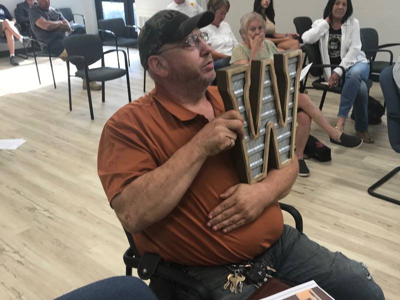 Western Cattle Company Factory Outlet is moving from Peru to Utica. Thursday, petitioner Robert Martens, holding a sample for the proposed facade, persuaded the Utica Planning Commission Commission to recommend approval of special uses.