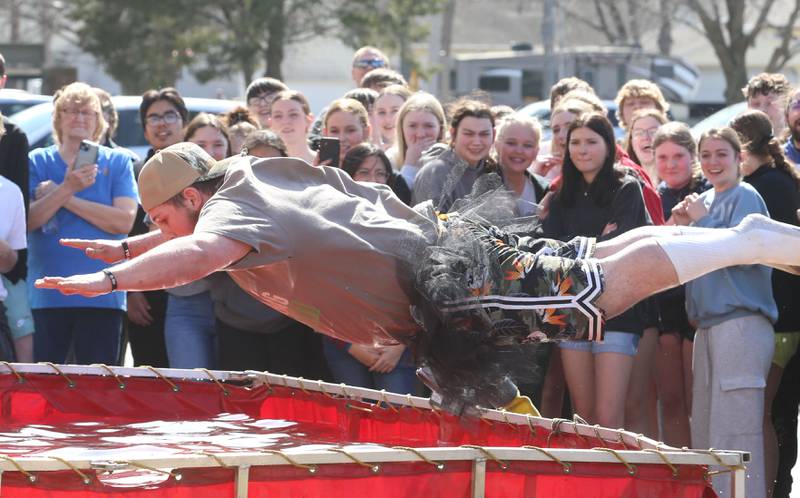 Putnam County High School student James Irwin jumps into a water tank during the Polar Plunge to support Special Olympics on Friday, March 14, 2025 at Putnam County High School.