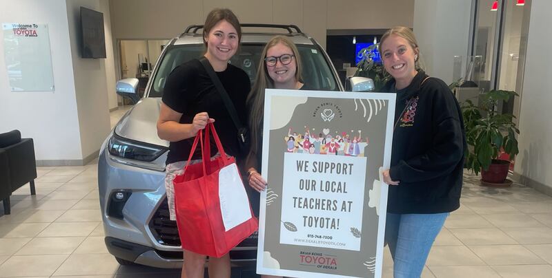 DeKalb school teacher receiving Brian Bemis Toyota of DeKalb school supplies donation