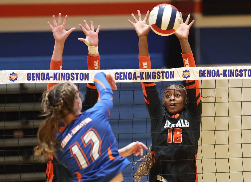 DeKalb's Zora Watts blocks the spike of Genoa-Kingston's Jessie Fredrickson during their game Wednesday, Sept. 11, 2024, at Genoa-Kingston High School.