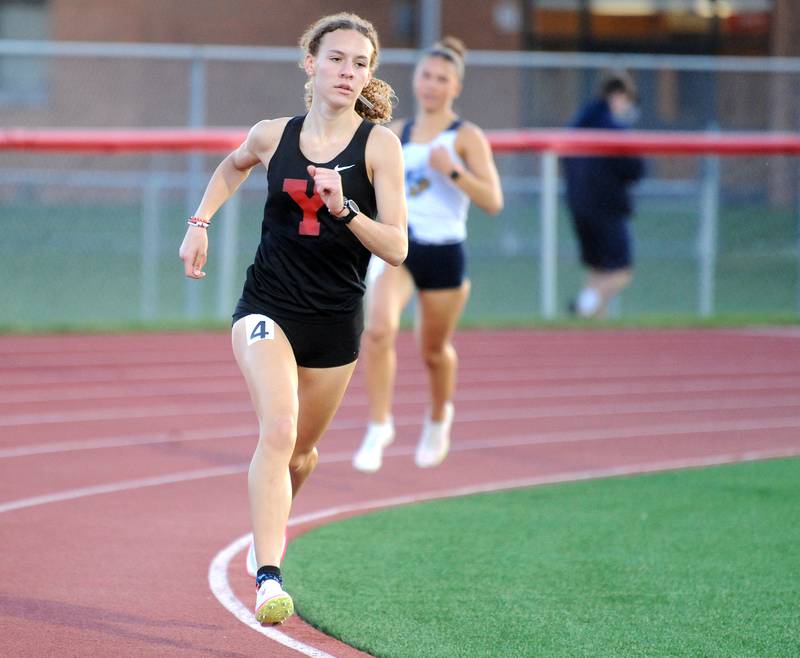 Yorkville's Allegra Triner maintains a big lead in the 800 Meter Run during the Matt Wulf Track and Field Invitational at Yorkville High School on Friday, April 12, 2024.