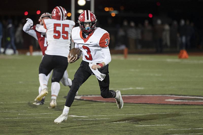 Amboy’s Tucker Lindenmeyer looks for running room Friday, Nov. 18, 2022 in the 8-man championship football game against West Central.