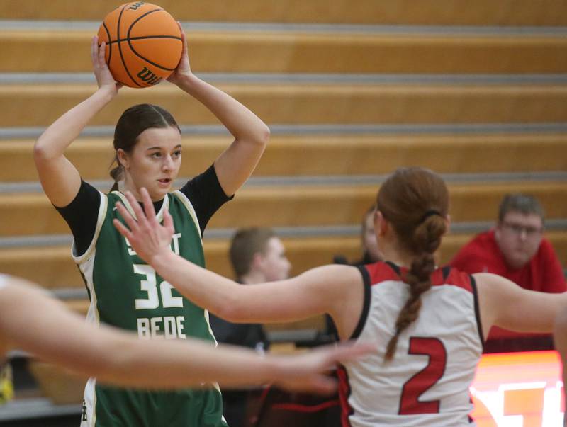 St. Bede's Quinn McClain passes the ball over the head ov Henry-Senachwine's Brynn Anderson on Thursday, Jan. 30, 2025 at Henry-Senachwine High School.