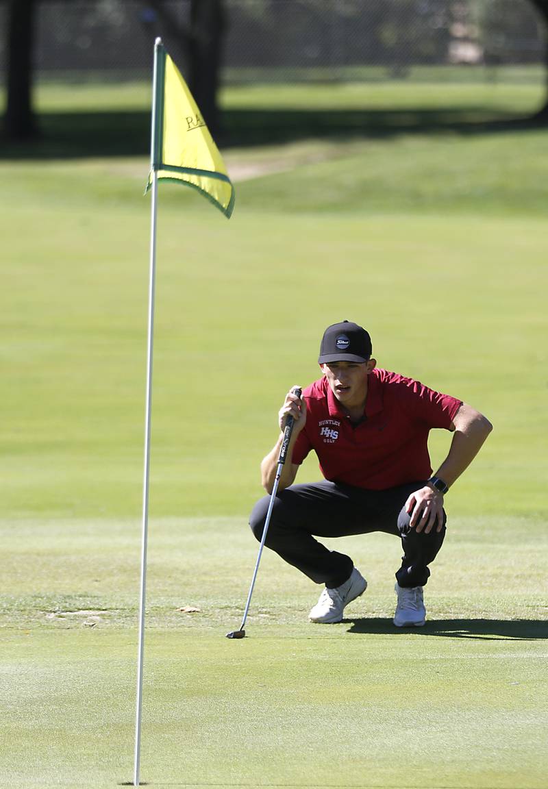 Huntley’s Brendan Busky lines up his putt on the 18th green during the IHSA Boys’ Class 3A Sectional Golf Tournament Monday, Oct. 3 2022, at Randall Oaks Golf Club in West Dundee.