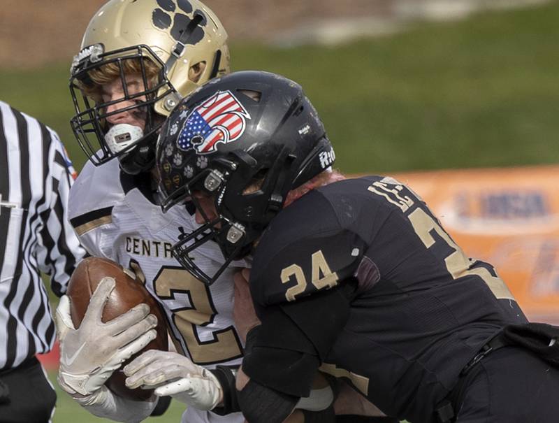 Lena-Winslow's Lucas Fye knocks Camp Point's Jack Thompson out of bounds Friday, Nov. 24, 2023 in the 1A state football championship game at Hancock Stadium in Normal.