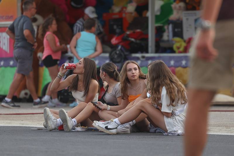 A group of teens take a breaks from the festivities for snacks at Old Canal Days on Friday June 7, 2024 in Lockport.
