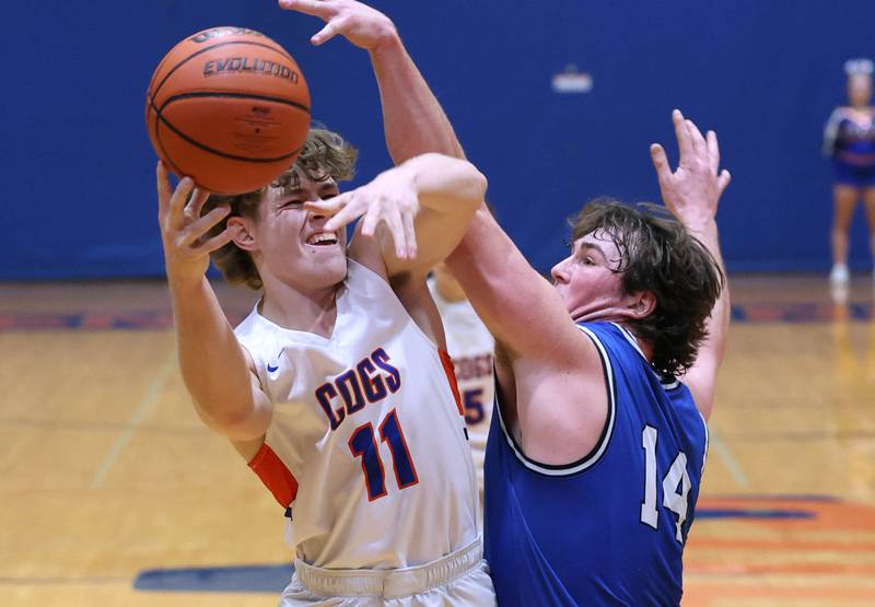 Genoa-Kingston's John Krueger tries to shoot over Hinckley-Big Rock’s Martin Ledbetter during their game Thursday, Dec. 7, 2023, at Genoa-Kingston High School.