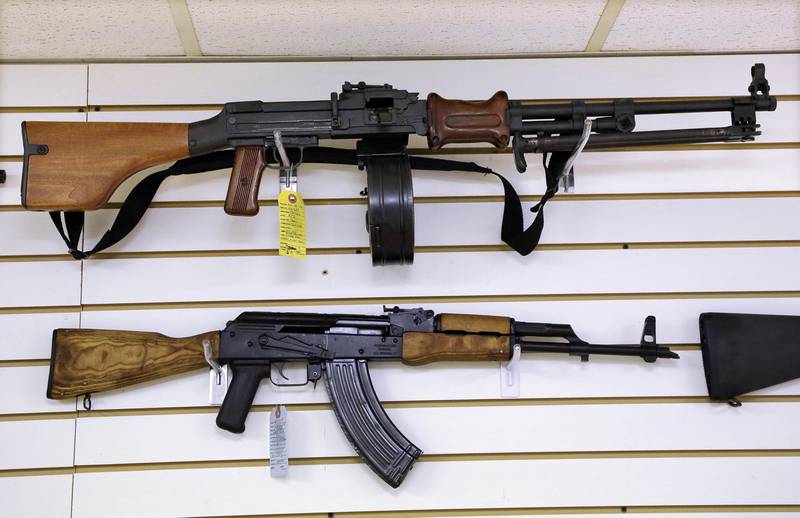 FILE - Assault style weapons are displayed for sale at Capitol City Arms Supply on Jan. 16, 2013, in Springfield, Ill. Illinois Attorney General Kwame Raoul on Monday, Jan. 23, 2023, asked a state appellate court to dismiss a temporary restraining order on Illinois' new ban on semiautomatic weapons. The two-week-old law was adopted in response to the 2022 mass shooting at the July 4th parade in the Chicago suburb of Highland Park. (AP Photo/Seth Perlman, File)