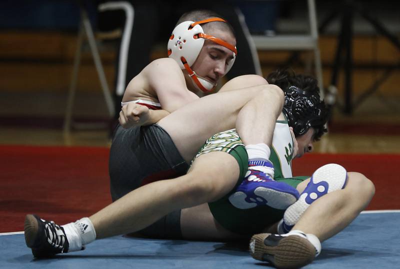 Marian Central's Kaden Harman tries to pin St. Patrick's Aiden Villegas in their 126-pound wrestling match Thursday, Jan. 19, 2023, at Marian Central High School in Woodstock.