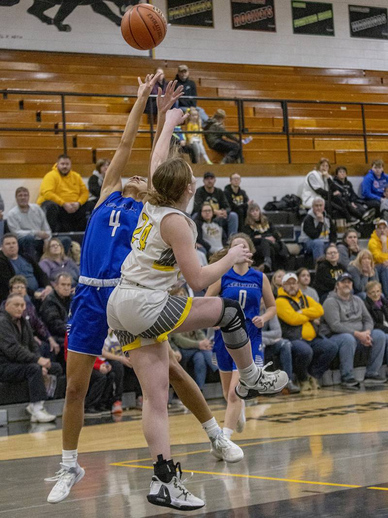 Newark's Kiara Wesseh reaches to grab a rebound over Putnam County's Gracie Ciucci during the Class 1A Regional final game on Thursday, Feb. 16, 2023 at Putnam County High School.