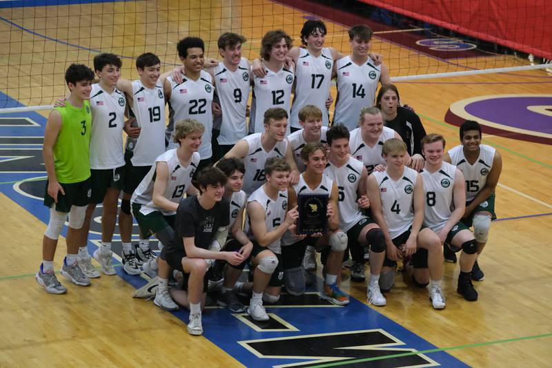 Glenbard West pose with the championship plaque after a 2 set win over Roncalli (IN) in the Lincoln-Way East Tournament title match. Saturday, April 30, 2022, in Frankfort.