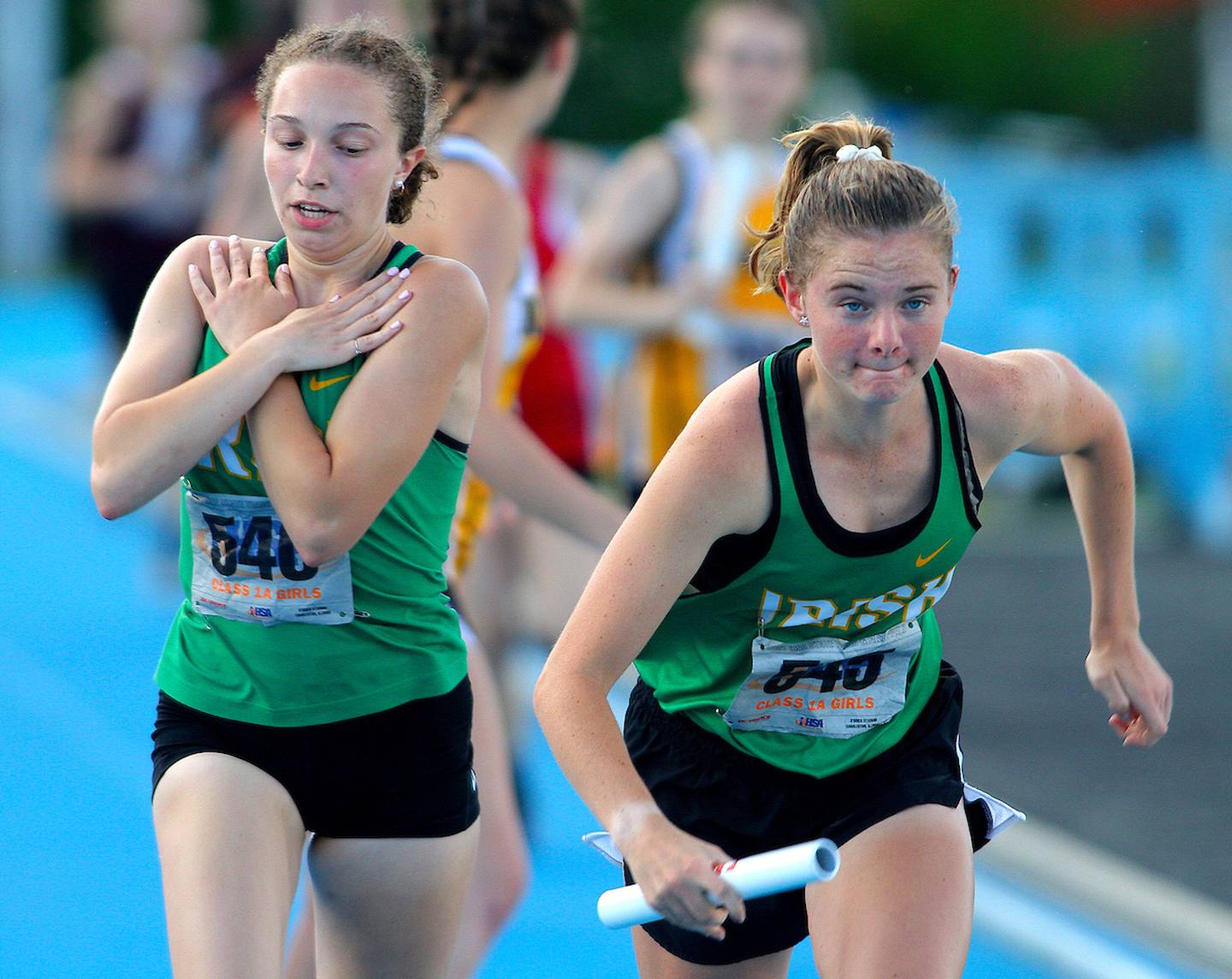 June 10, 2021 - Charleston, Illinois - After takin the baton from teammate Audrey Jenkins, Seneca's Amber Vroman starts out on her leg of the Class 1A 4x400-Meter Relay at the Illinois High School Association Track & Field State Finals.  (Photo: PhotoNews Media/Clark Brooks)