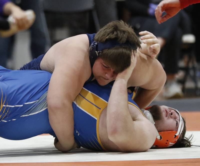 Cary-Grove’s Lucas Burton tries to pin Fenton’s Thomas Klos in the 295-pound championship match of the IHSA 2A Crystal Lake Central Wrestling Sectional on Saturday, Feb. 15, 2025, at Crystal Lake Central High School.