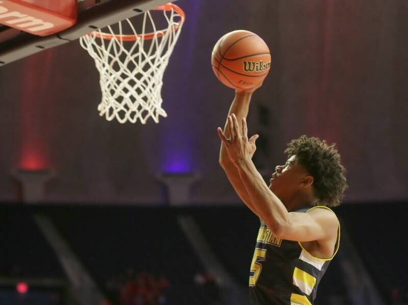 Yorkville Christian's Tyler Burrows (5) runs in all alone to score on a layup over Steeleville in the Class 1A State semifinal game on Thursday, March 10, 2022 at the State Farm Center in Champaign.