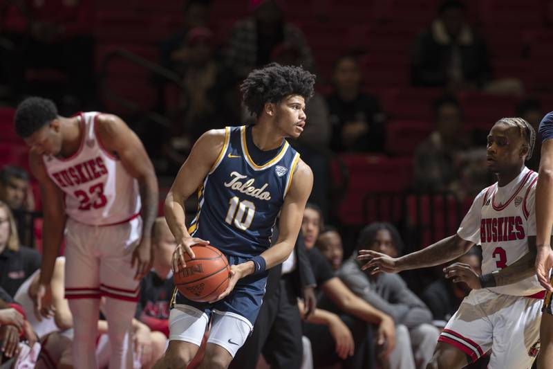 Toledo guard Ray J Dennis, a former Oswego East star, looks for an open teammate during a game on Saturday, Jan. 14 at NIU.