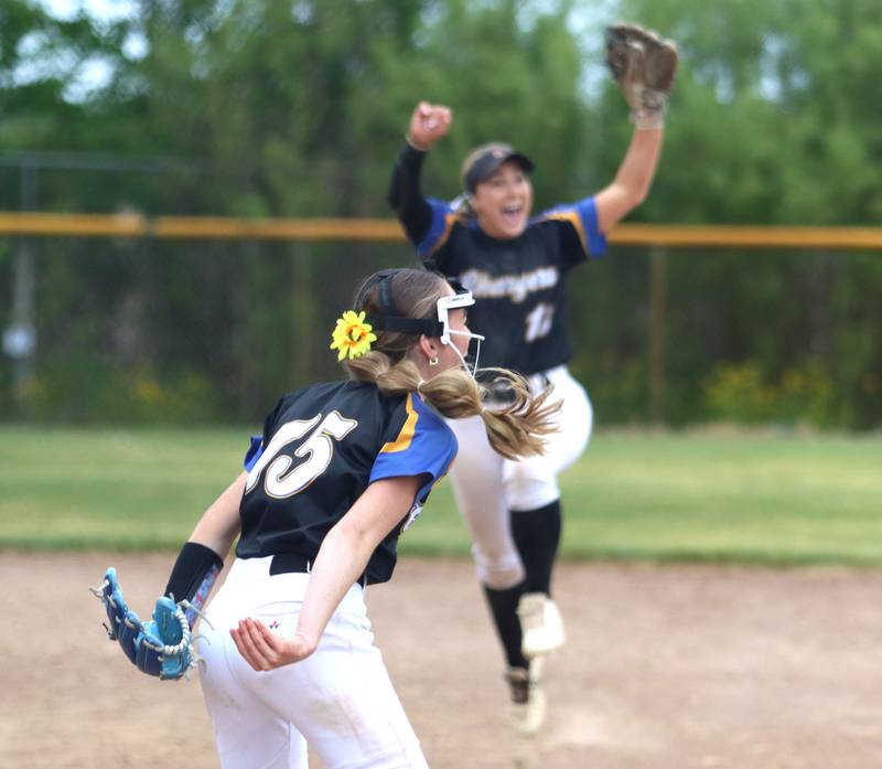 Corina Maratea, front, and Aurora Central Catholic’s Chargers celebrate a 4-3 win over Marengo in varsity girls softball IHSA Class 2A Regional Title Game action on Friday, May 22, 2026 at Raymond Benoy Field on the campus of Marian Central High School in Woodstock.