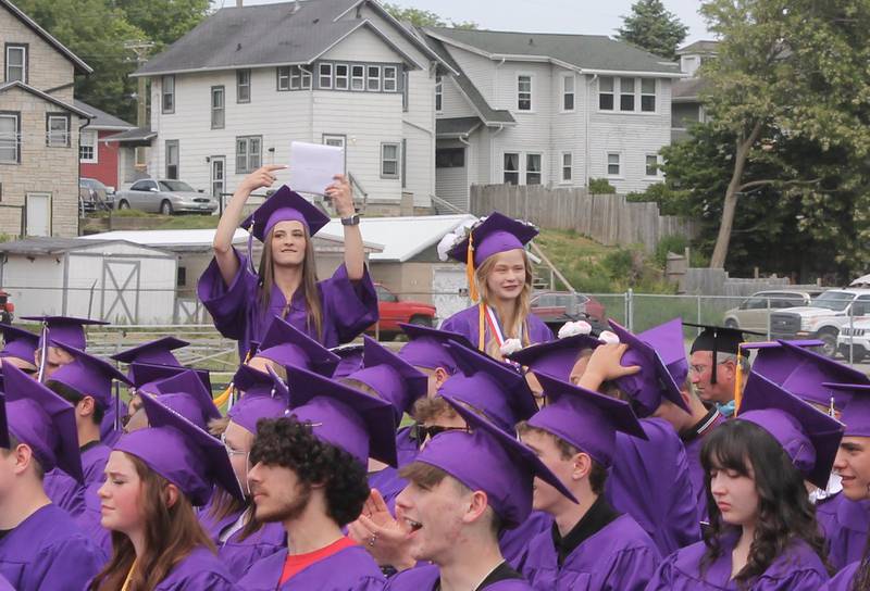 Diploma, right here. Erin Ward, a member of the Dixon High School Class of 2023, gestures to her diploma after it was presented on Sunday, May 28, 2023.