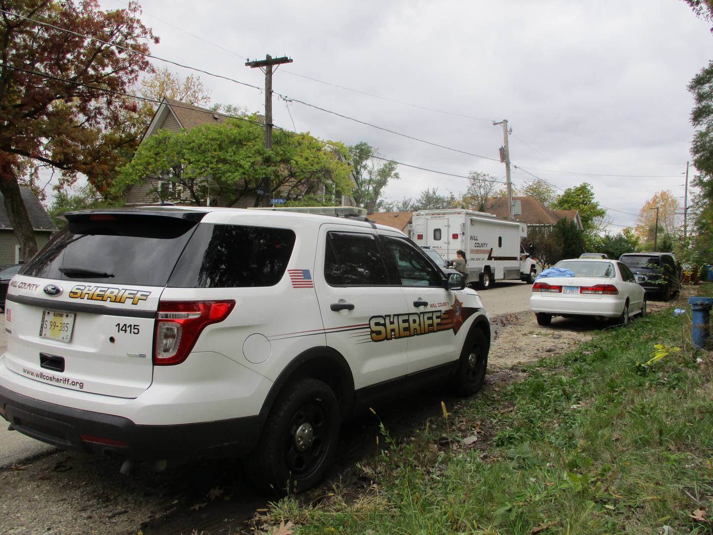 A Will County Sheriff's squad car parked on Sunday, Oct, 31, 2021 on East Jackson Street in Joliet Township where two people were killed and 10 wounded in a shooting at a Halloween Party at about 12:39 a.m.