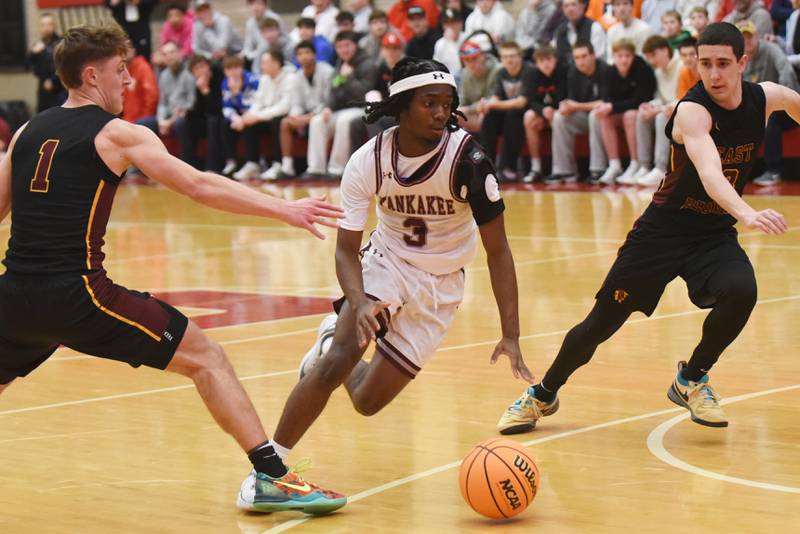 Kankakee's Cedric Terrell III splits a pair of East Peoria defenders during the IHSA Class 3A Ottawa Sectional semifinals Wednesday, March 4, 2026.