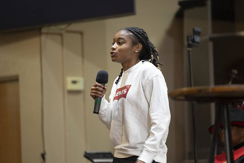 Taah Liberty says a few words about Peace and Justice Award winner Sterling schools counselor Christine Herren Sunday, Jan. 19, 2025. Herren was not able to be present for the award.