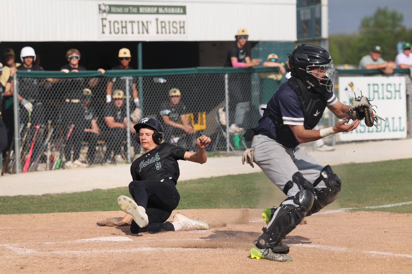 Bishop McNamara's Nick Pignatiello slides safely into home during the Fightin' Irish's game against Hope Academy on Tuesday, May 13, 2025.