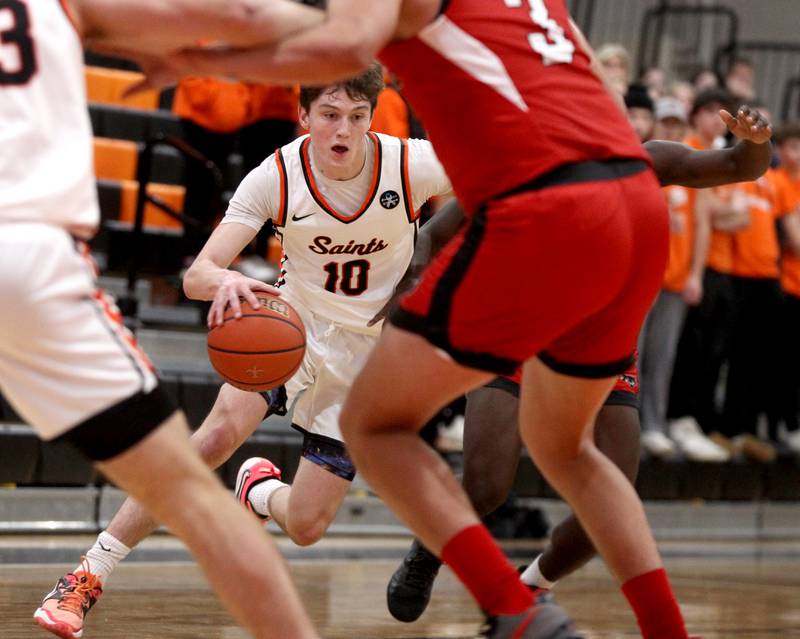 St. Charles East’s Steven Call (10) drives toward the basket during a game against East Aurora in the 63rd Annual Ron Johnson Thanksgiving Tournament at St. Charles East on Monday, Nov. 21, 2022.