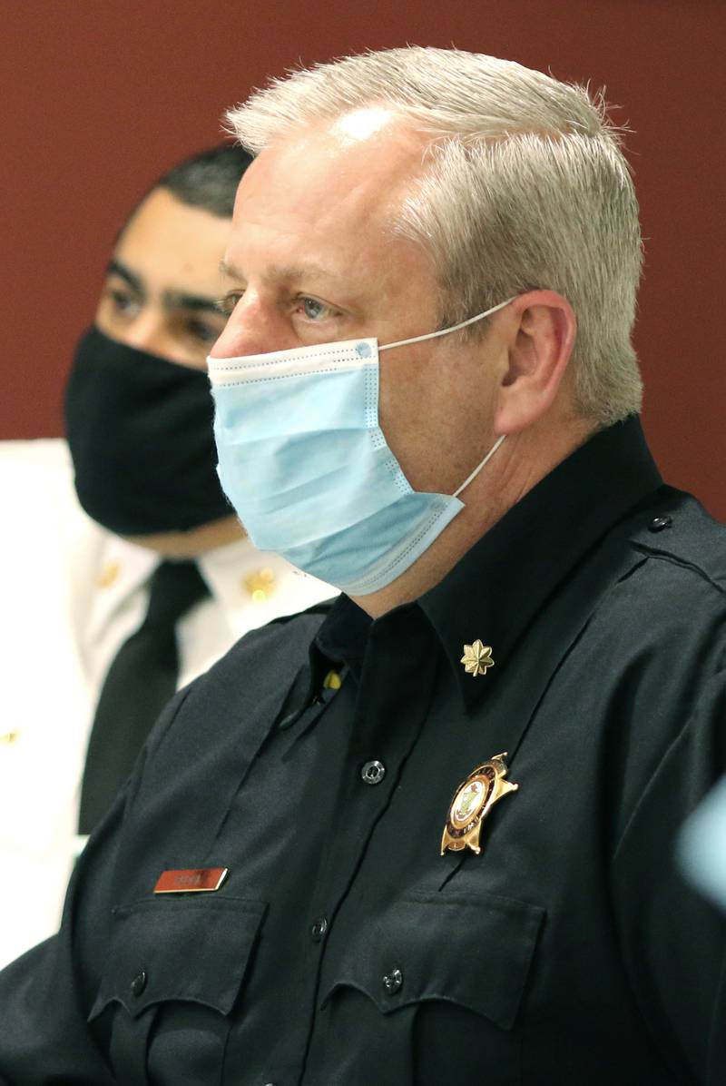 DeKalb Interim Police Chief Bob Redel listens Monday at the City Council meeting, as City Manager Bill Nicklas thanks him for all his hard work and everything he has done for DeKalb. Illinois State Police Col. David Byrd was named at the meeting as the city's next full-time police chief.