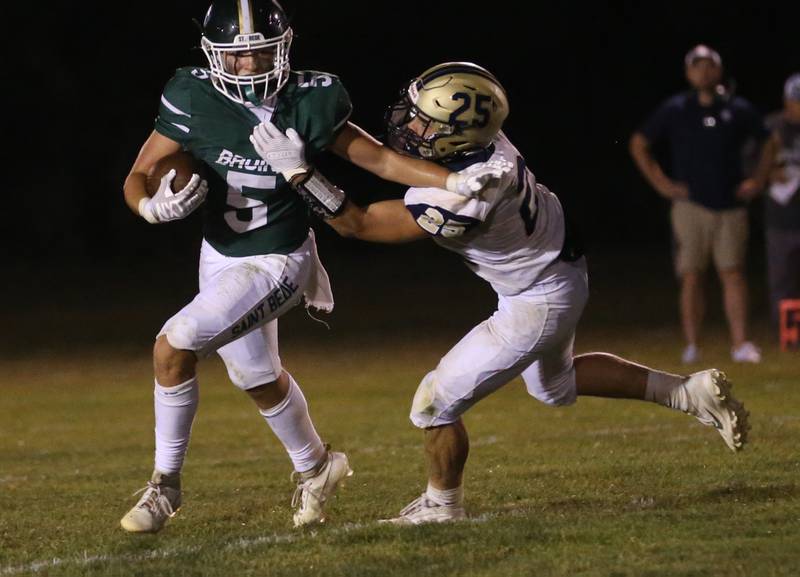 St. Bede's Halden Hueneburg is brought down by Mercer County's Daylin Estabrook on Friday, Sept. 1, 2023 at St. Bede Academy.