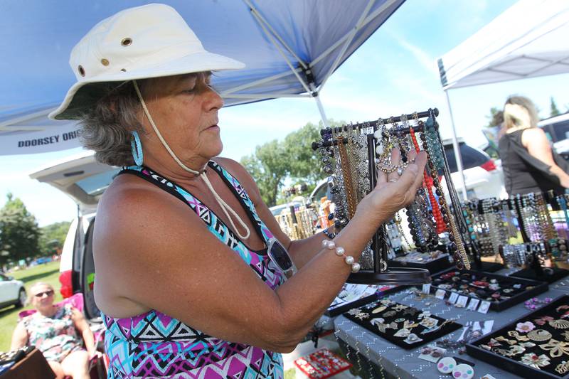 Deb Dorsey, of Wauconda with DDorsey Originals, shows one of the necklaces she was featuring at the Arts & Crafts Show during Wauconda Fest in Wauconda.  (6/26/22)