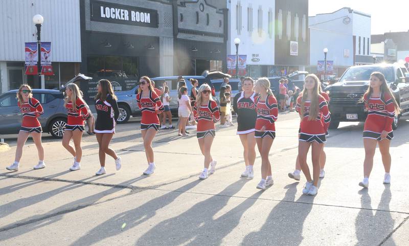 The Hall High School cheerleaders walk down West St. Paul Street during the Homecoming parade on Thursday, Sept. 18, 2025 downtown Spring Valley.