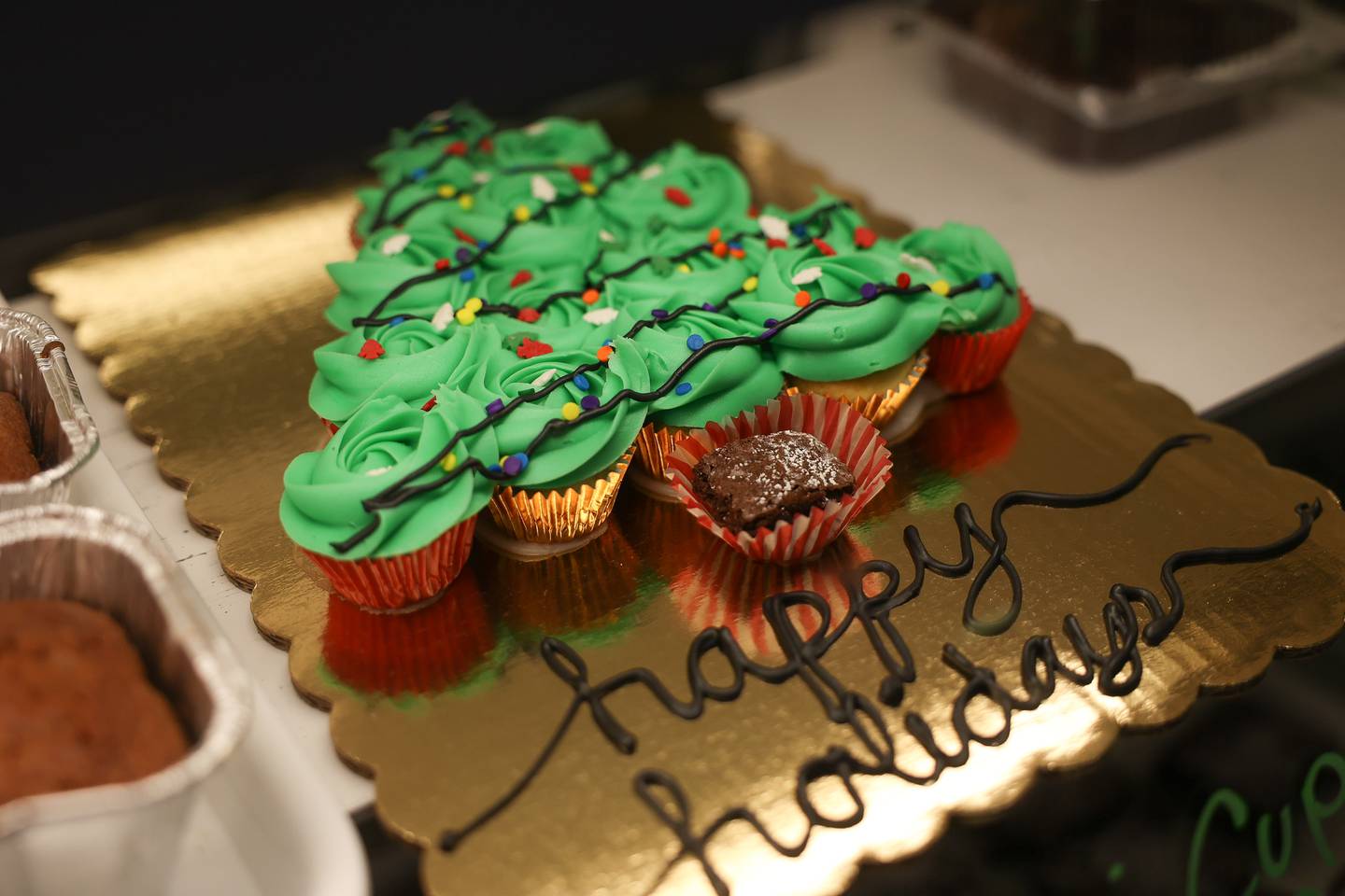 Megan DiCaro gets creative with cupcake for the holidays at her Springview Sweets Bakery located at the Lockport Metra train station in downtown Lockport on Friday, Dec.15th. Megan is current in 1st place in The Greatest Baker online voting contest, presented by Cake Boss Buddy Valastro.