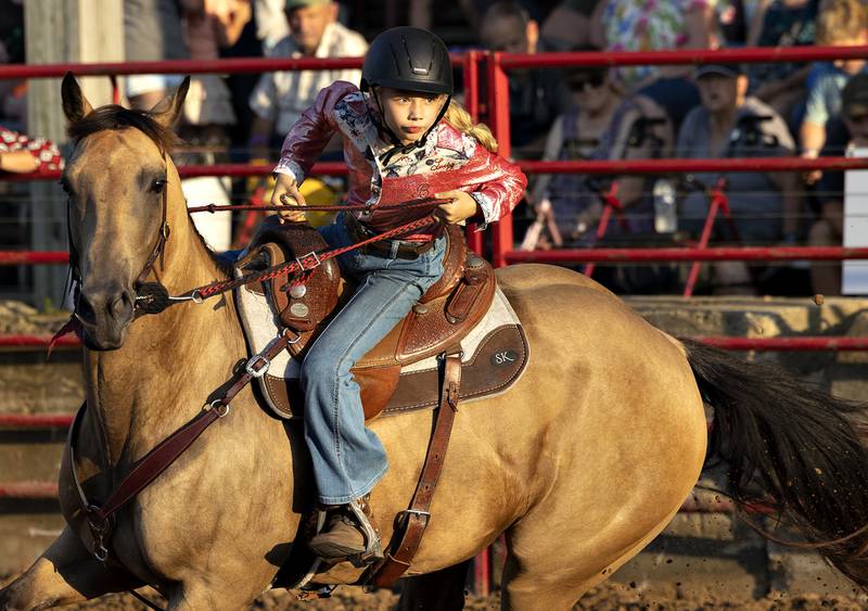 Addessa Hummel competes in the barrel racing event Thursday, August 7, 2025, at Carroll County Fair’s T and A Bucking Bulls Rodeo.